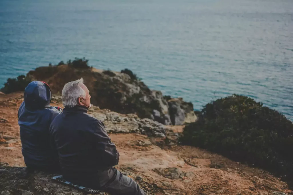 two old men at river bank