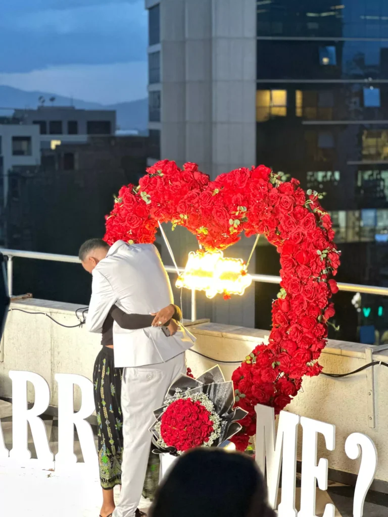 Two Ethiopians hugging each other after a marriage proposal