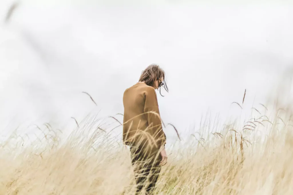 A man in regret, in a field