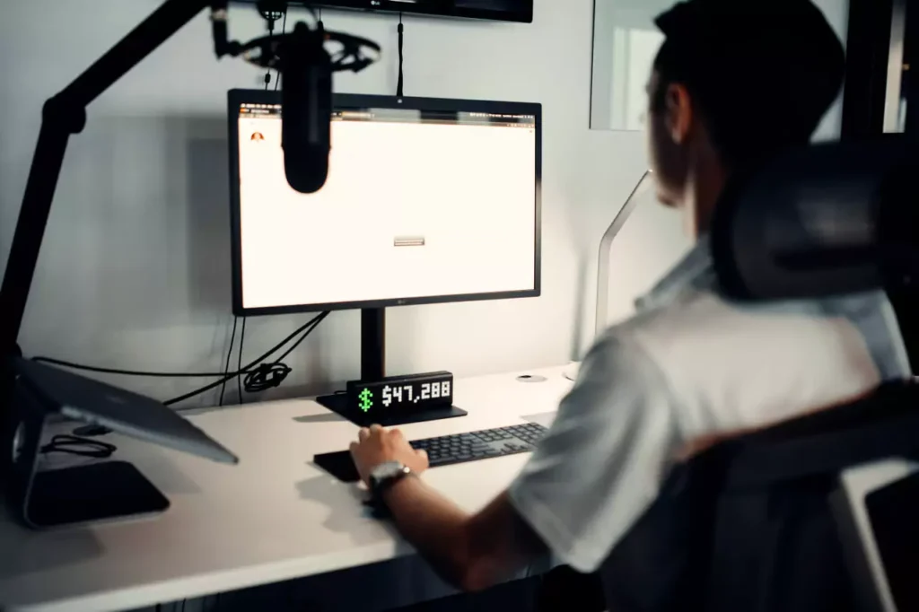 A man working on his computer toward success
