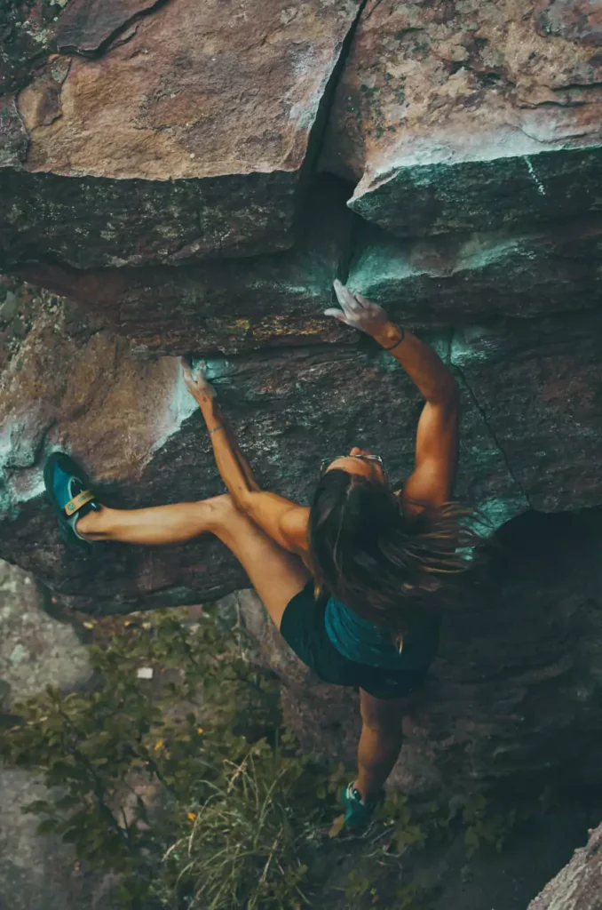 A woman climbing showing resilience
