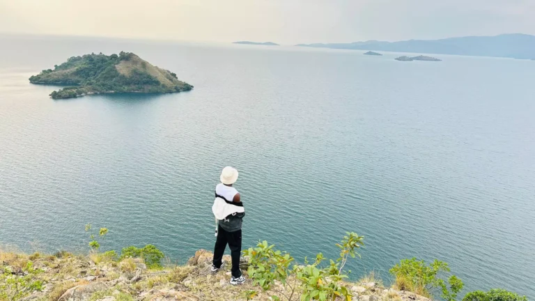 Jokondo Lucky posing over to Lake kivu in Kibuye