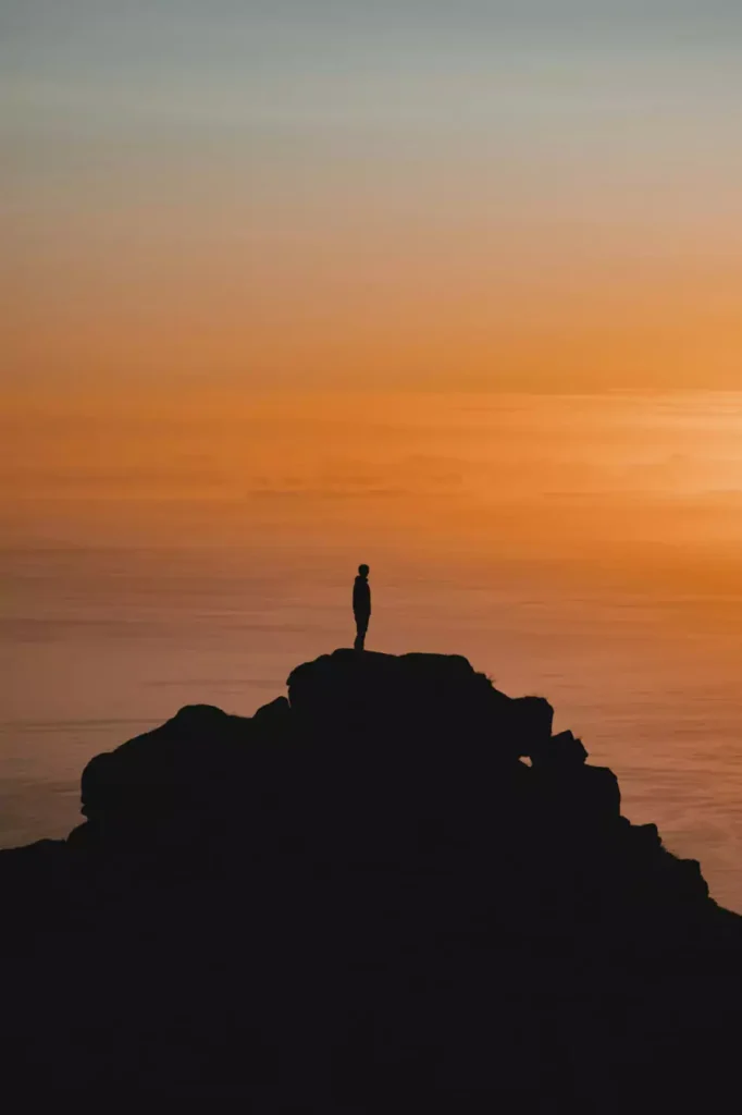 Man on top of mountain aura farming