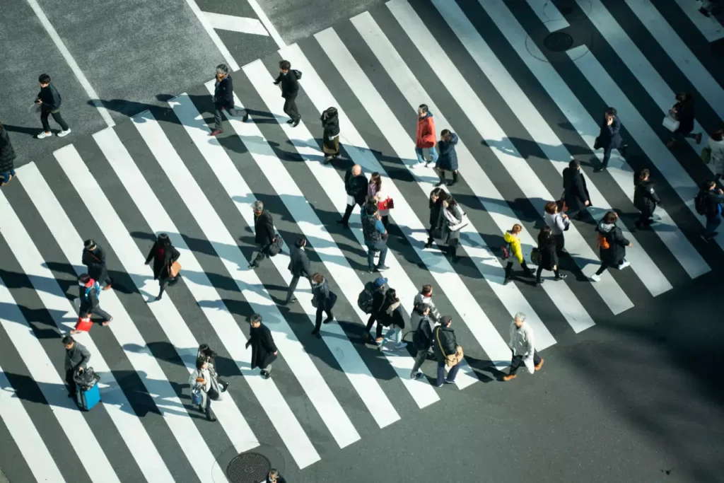 People walking in zebra lines creating an illusion