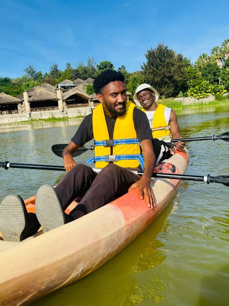 Lucky and Ermias kayaking in lake kuriftu