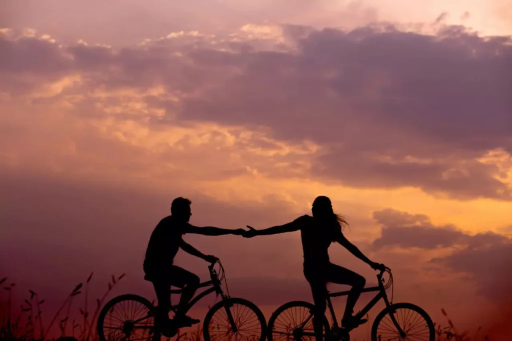 couples on a bike greeting