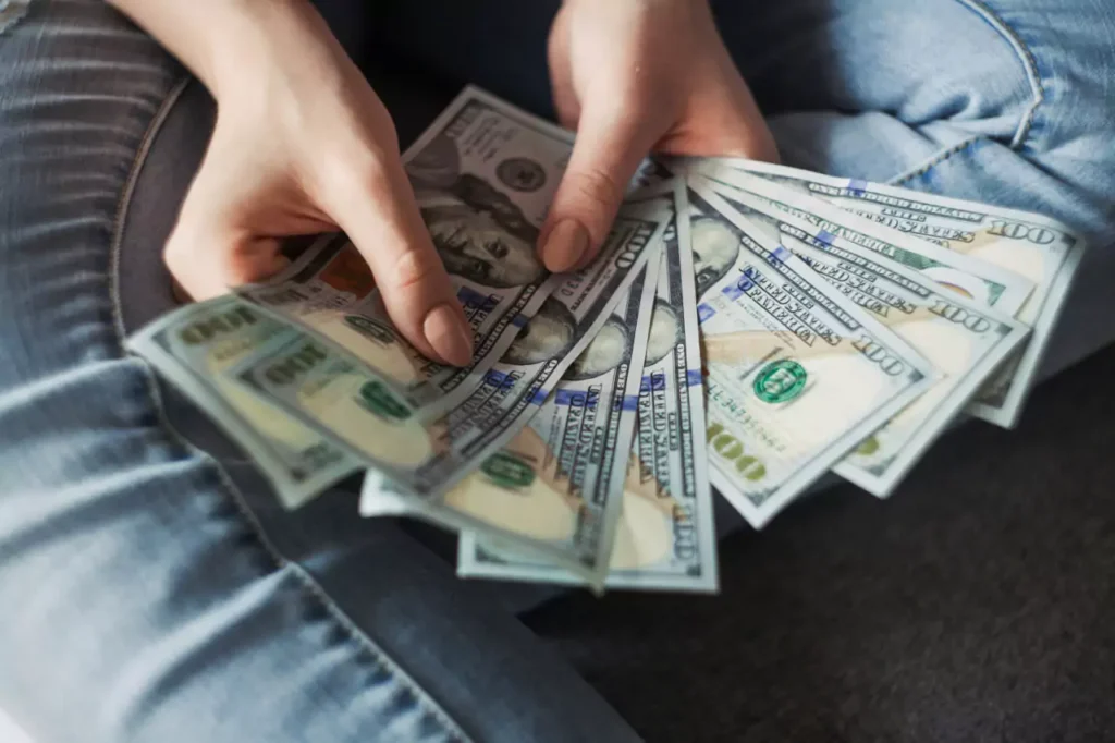 woman counting dollars