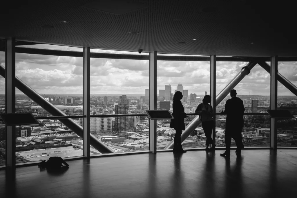 3 business people in suit in a black and white photo