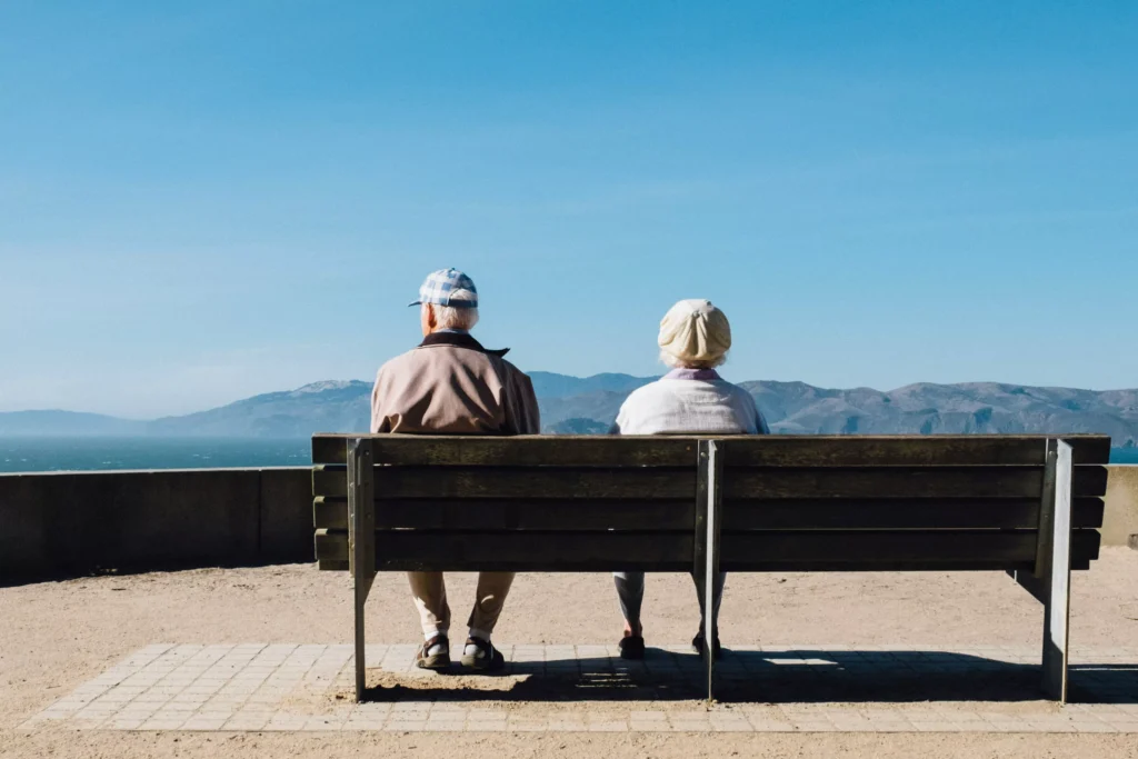 old people sitting on a bench