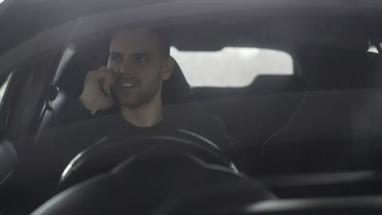 A person on phone angry in a car