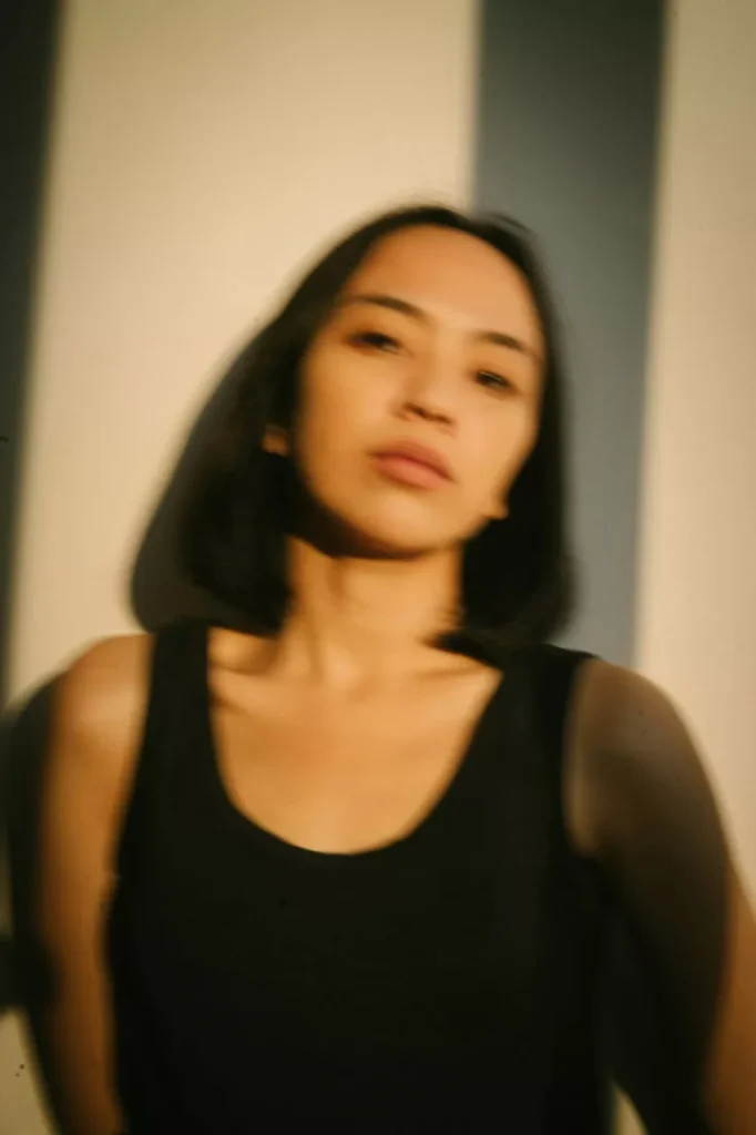 a blurry woman in black