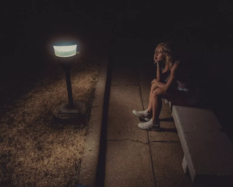 a lonely girl under the light